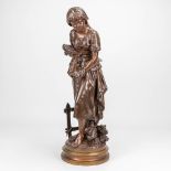 Mathurin MOREAU (1822-1912) a young lady with flowers, a bronze statue on swivel base. Marked Hors C
