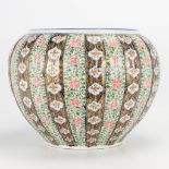A large Japanese cache-pot, with hand-painted floral decor. (30 x 36 cm)