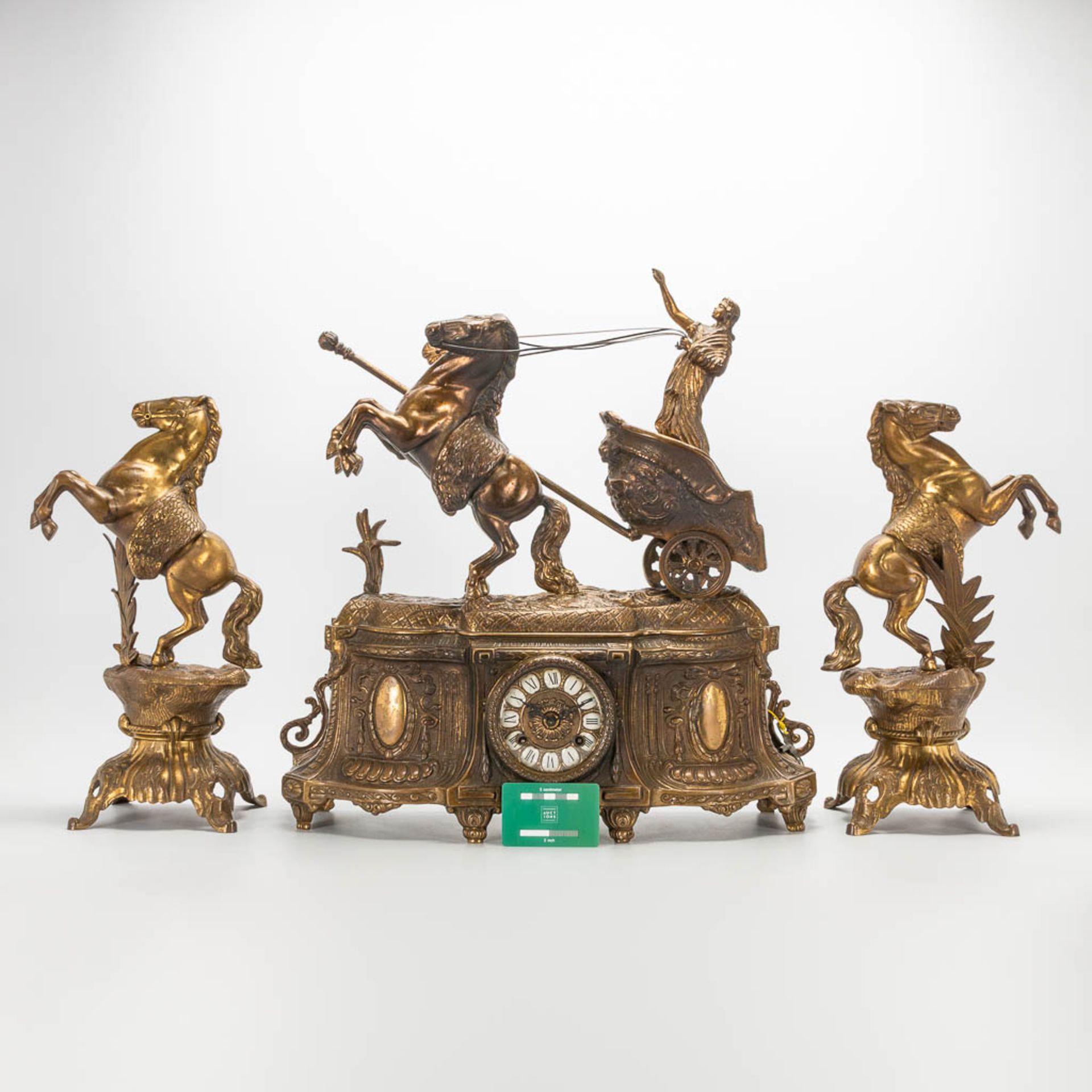 A 3 piece garniture clockset made of bronze, consisting of a clock with battle cart and 2 side piece - Image 2 of 18