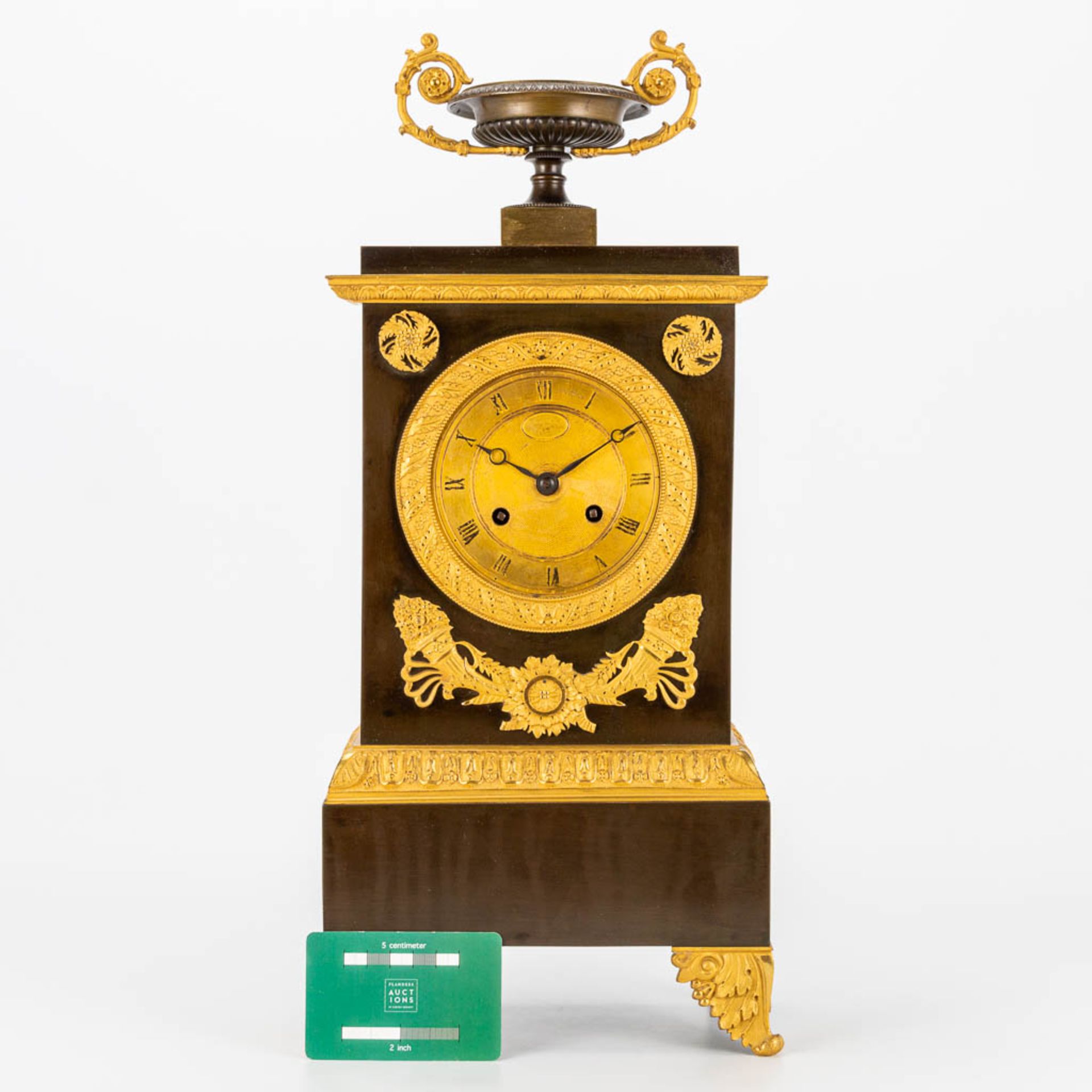 A table clock made in empire period of patinated and gilt bronze. 19th century. (10 x 19,5 x 46 cm) - Image 9 of 17
