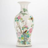 A Chinese vase with decor of peonies and birds. 19th/20th century. (46 x 20 cm)