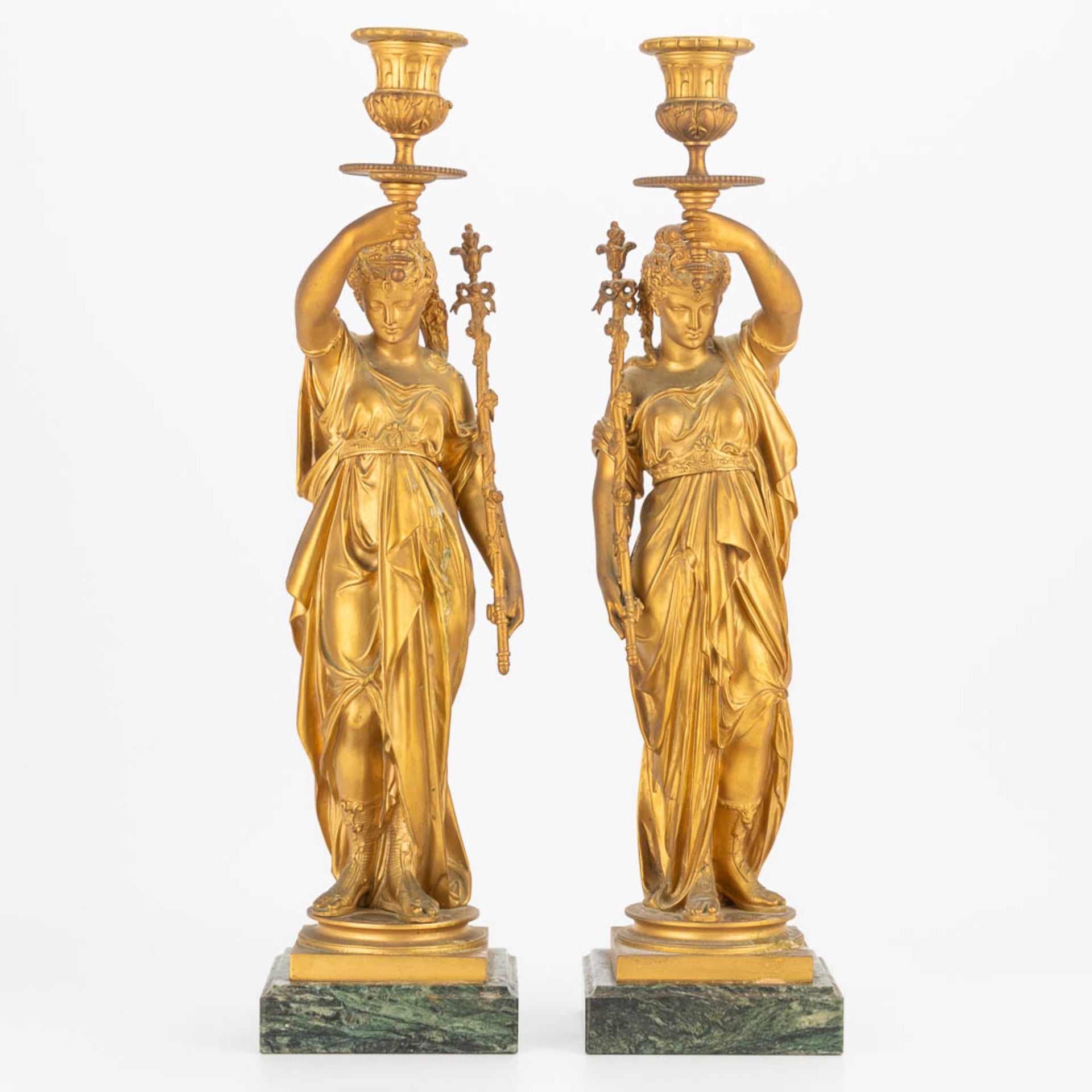 A pair of candlesticks made of gilt bronze with a pair of Greek-Roman ladies, marble base. Second ha