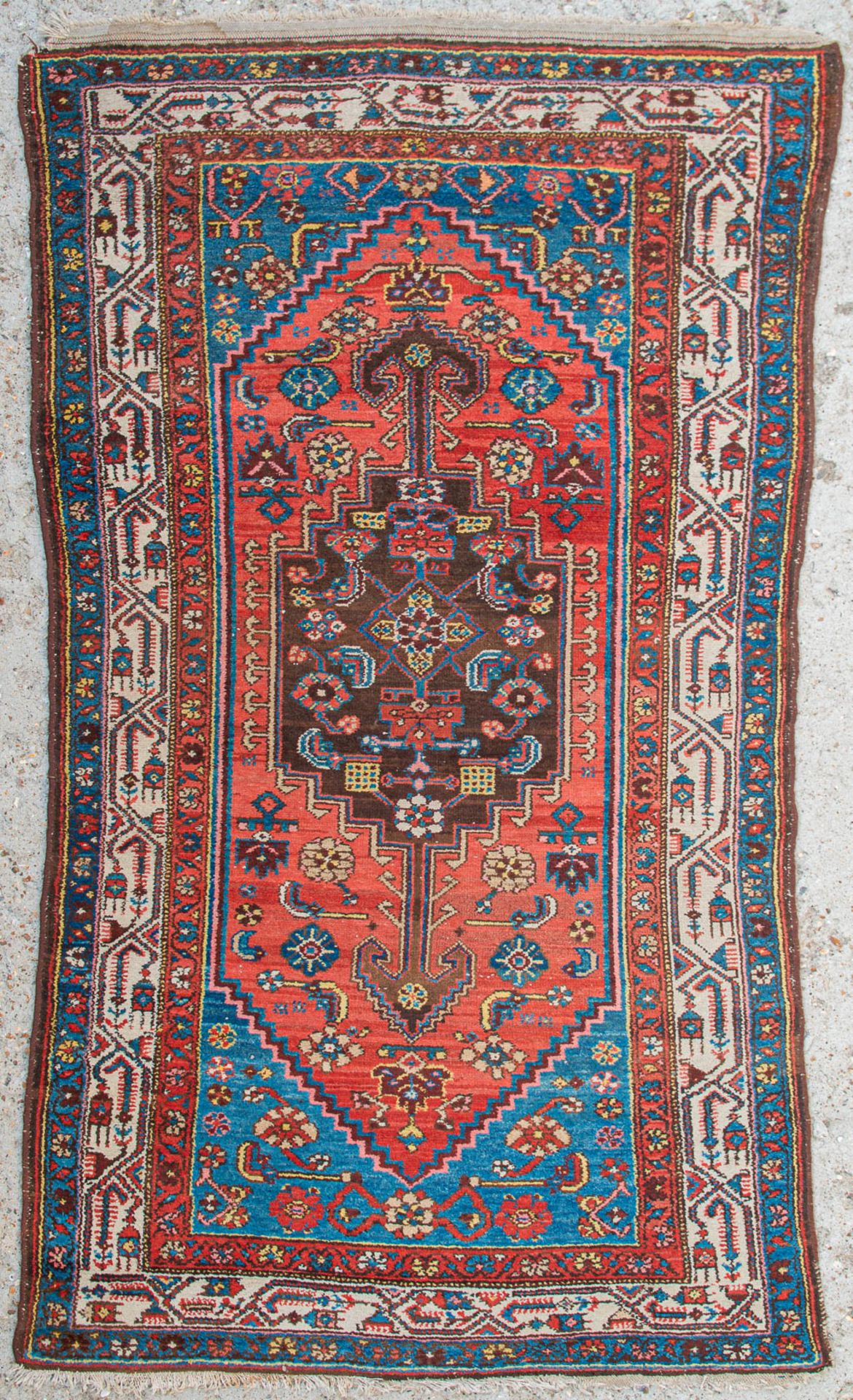 An Oriental hand-made carpet. (126 x 211 cm)