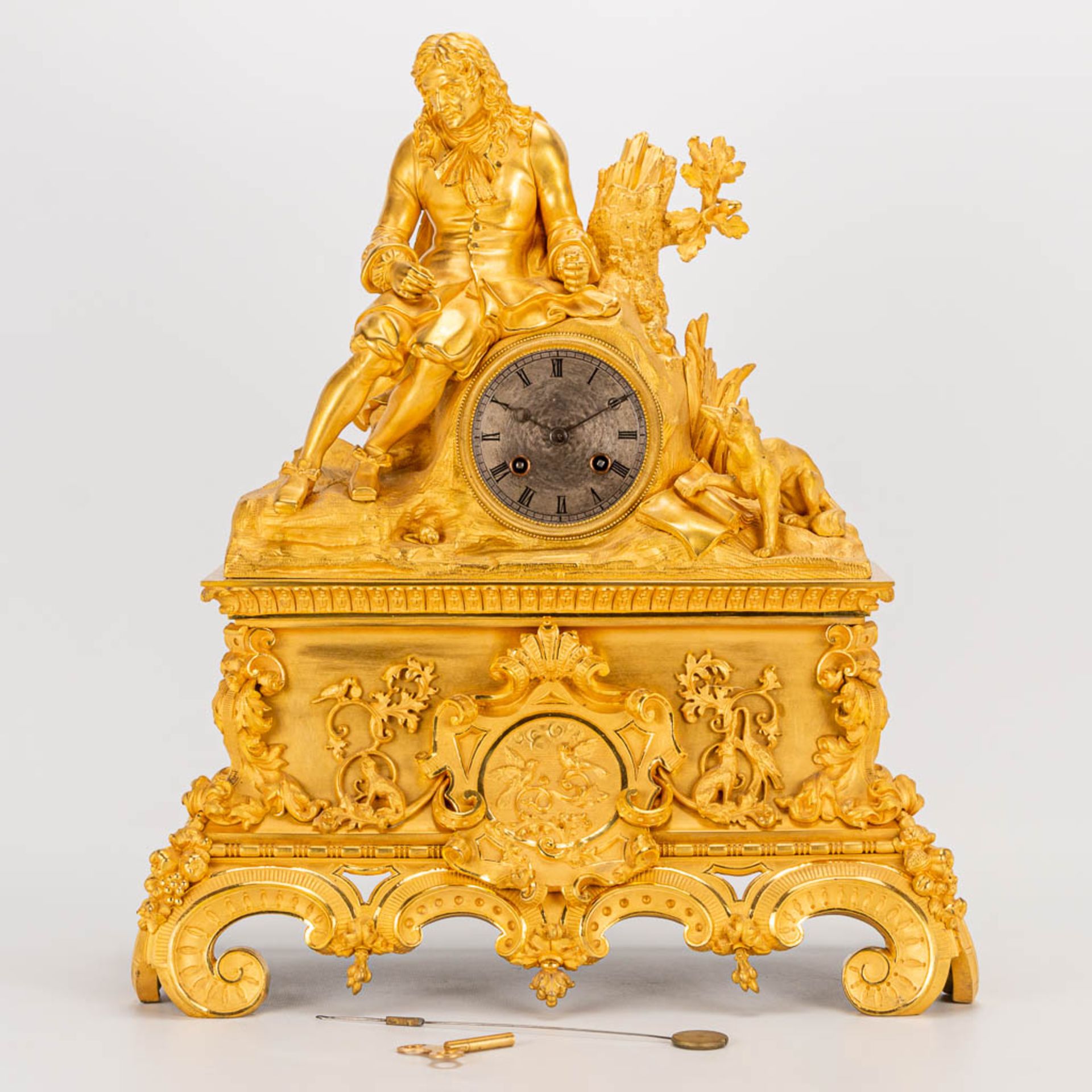 A table clock made of ormolu bronze with a sitting figurine. The second half of the 19th century. (1 - Image 11 of 24