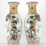 A pair of Chinese vases made of porcelain hand painted decor with peacocks. Marked Qianlong. 20th ce