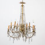 An antique gas chandelier, built with electricity. Bronze and glass bells. With additional glass bel