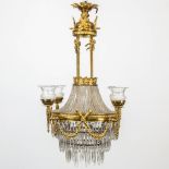 A Robe-a-Perles chandelier made of bronze and glass in empire style. Transformed gas chandelier, 19t