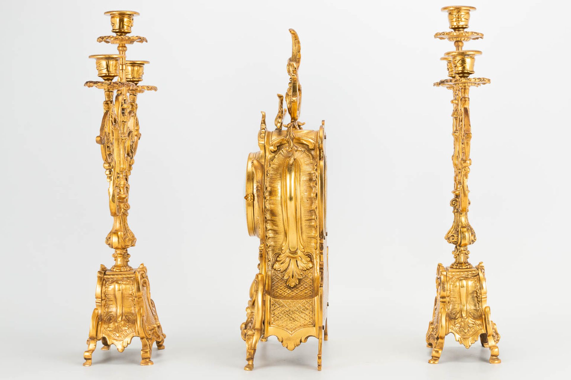 A 3 piece garniture clockset made of bronze, consisting of a clock and 2 candelabra. (9 x 22 x 41 cm - Image 5 of 17