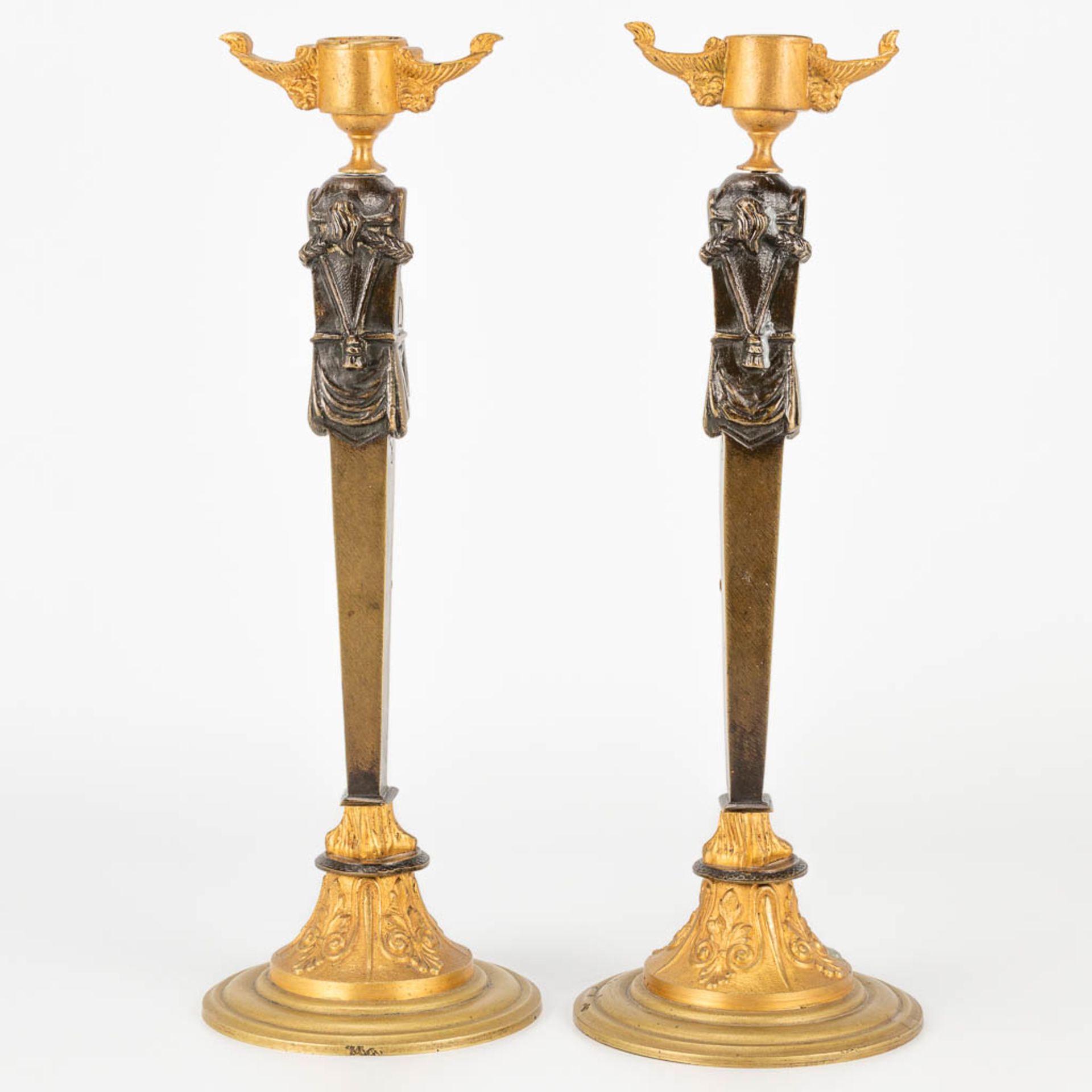 A pair of candlesticks made of gilt and patinated bronze in empire style. (27,5 x 9,5 cm) - Image 5 of 15