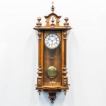 A wood hanging clock. The first half of the 20th century. (16 x 36,5 x 120 cm)