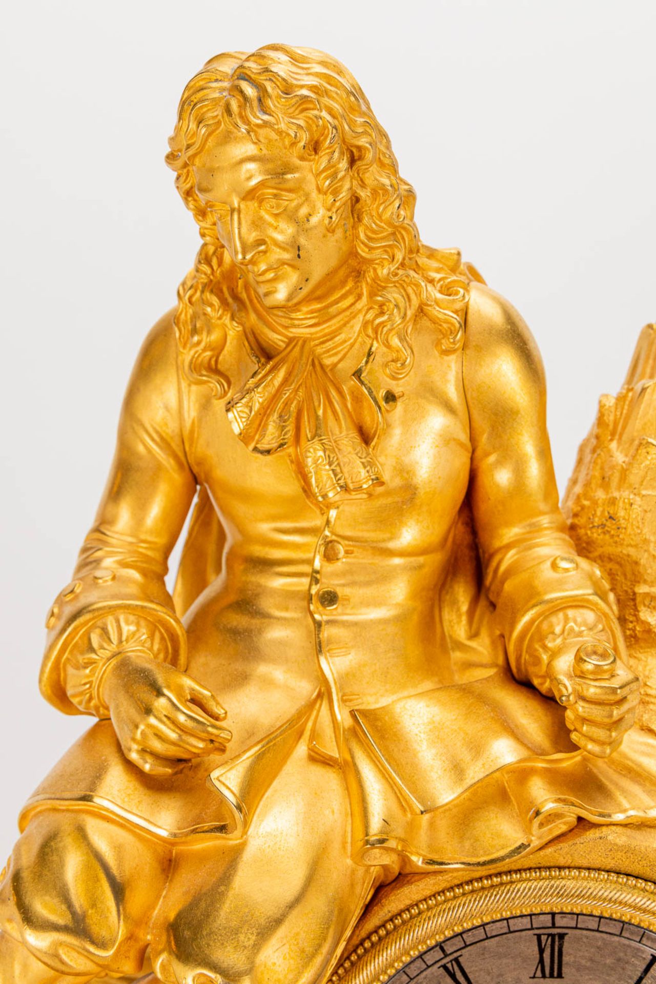 A table clock made of ormolu bronze with a sitting figurine. The second half of the 19th century. (1 - Image 13 of 24