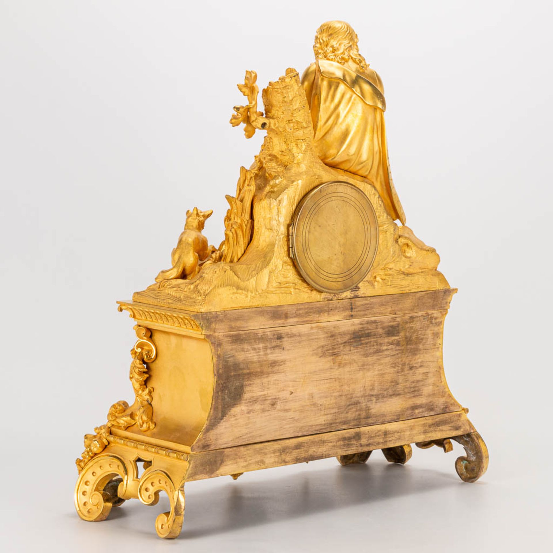 A table clock made of ormolu bronze with a sitting figurine. The second half of the 19th century. (1 - Image 4 of 24