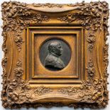 A large framed medallion of Napoleon Bonaparte made of bronze. (9,5 cm)