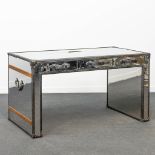 A desk made of polished metal and leather, in the shape of a trunk. (79 x 148,5 x 81 cm)