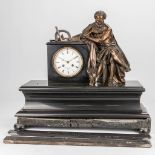 A black mantle clock with bronze statue of a scientist, marked Vanderheyden in Ghent. (53 x 21 x 47