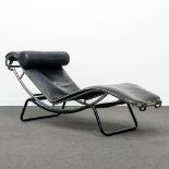 A mid-century lounge chair in the style of Le Corbusier LC4, made of metal and leather. (164 x 59 x