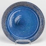 Rogier VANDEWEGHE (1923-2020) A plate made of ceramics with exceptional blue glaze. (2,5 x 27 cm)