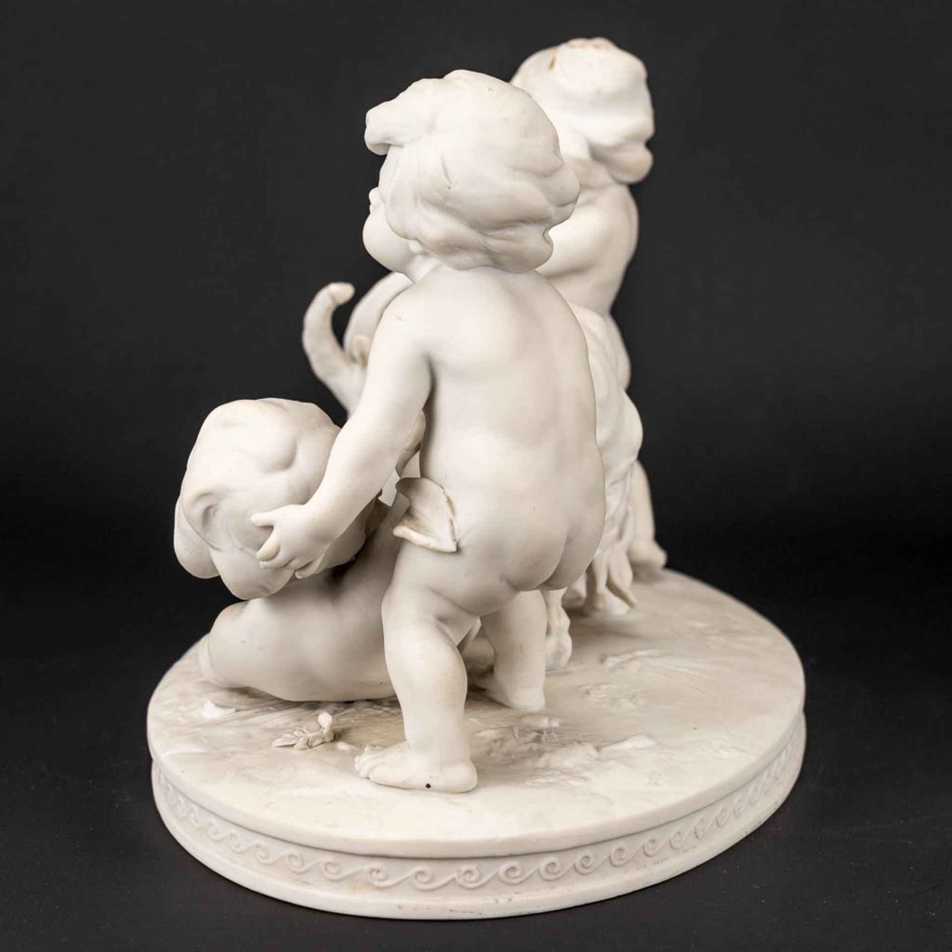 A group of kids and a goat made of biscuit porcelain and marked Richard Eckert& Co, Volkstedt. - Image 4 of 15