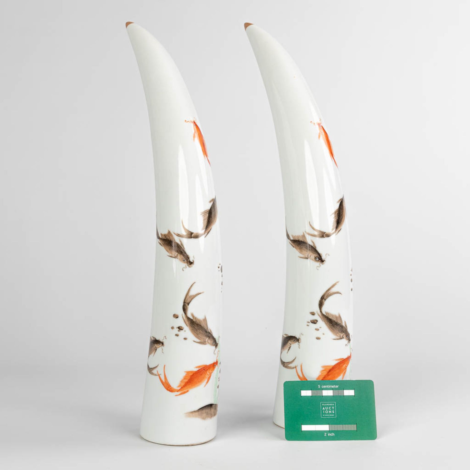 A pair of tusks, made of Chinese porcelain and decorated with fish. - Image 2 of 12