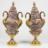 A pair of cassolettes made of marble and decorated with bronze dragons. 19th century.