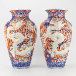 A pair of vases made of Japanese porcelain and decorated with dragons in Imari style.