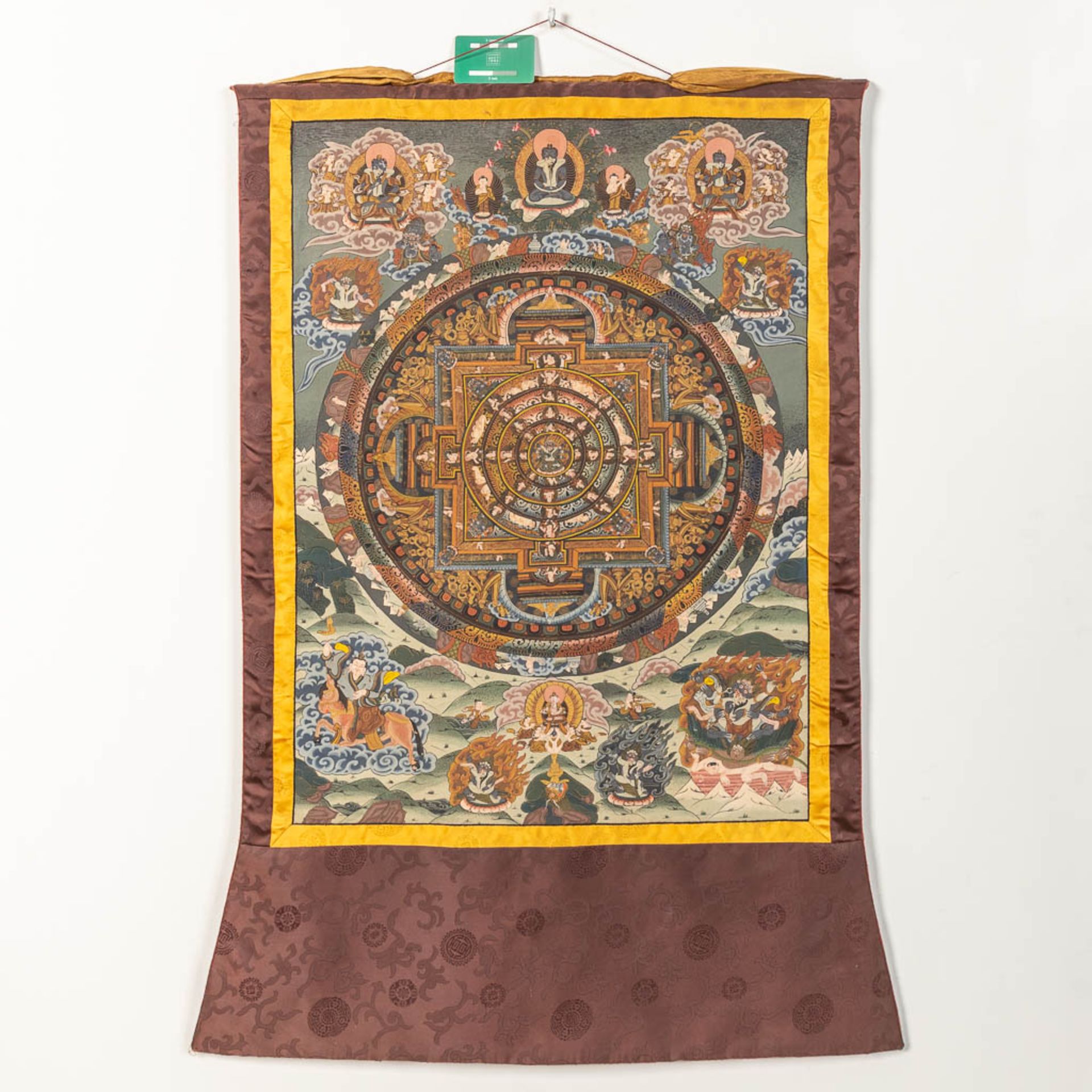 An Oriental Thangka, with hand-painted decor on a silk base. - Image 3 of 9