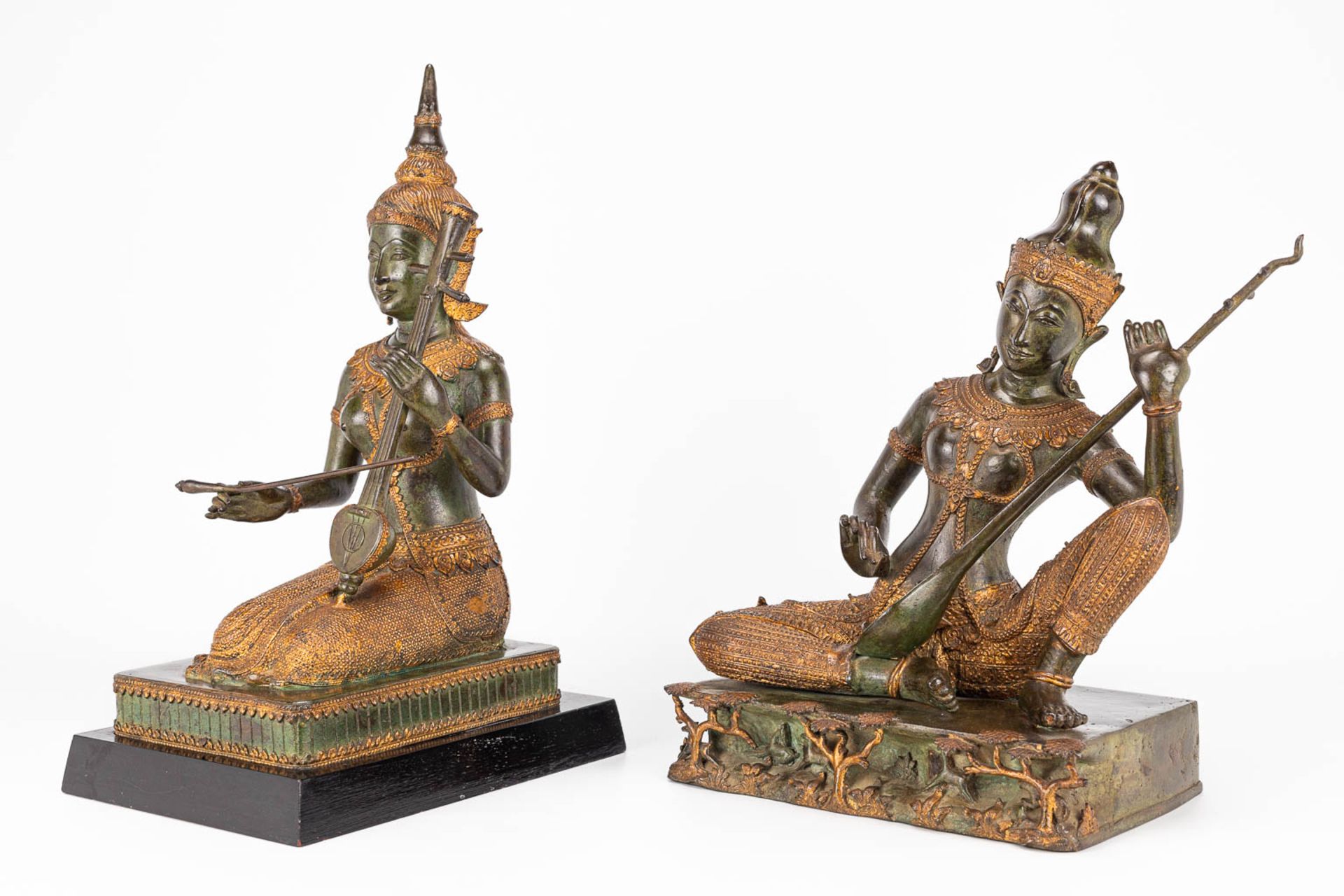 A collection of 2 oriental musical buddha's, made of metal. - Image 8 of 15