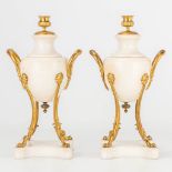 A pair of bronze mounted marble cassolettes en candlesticks.