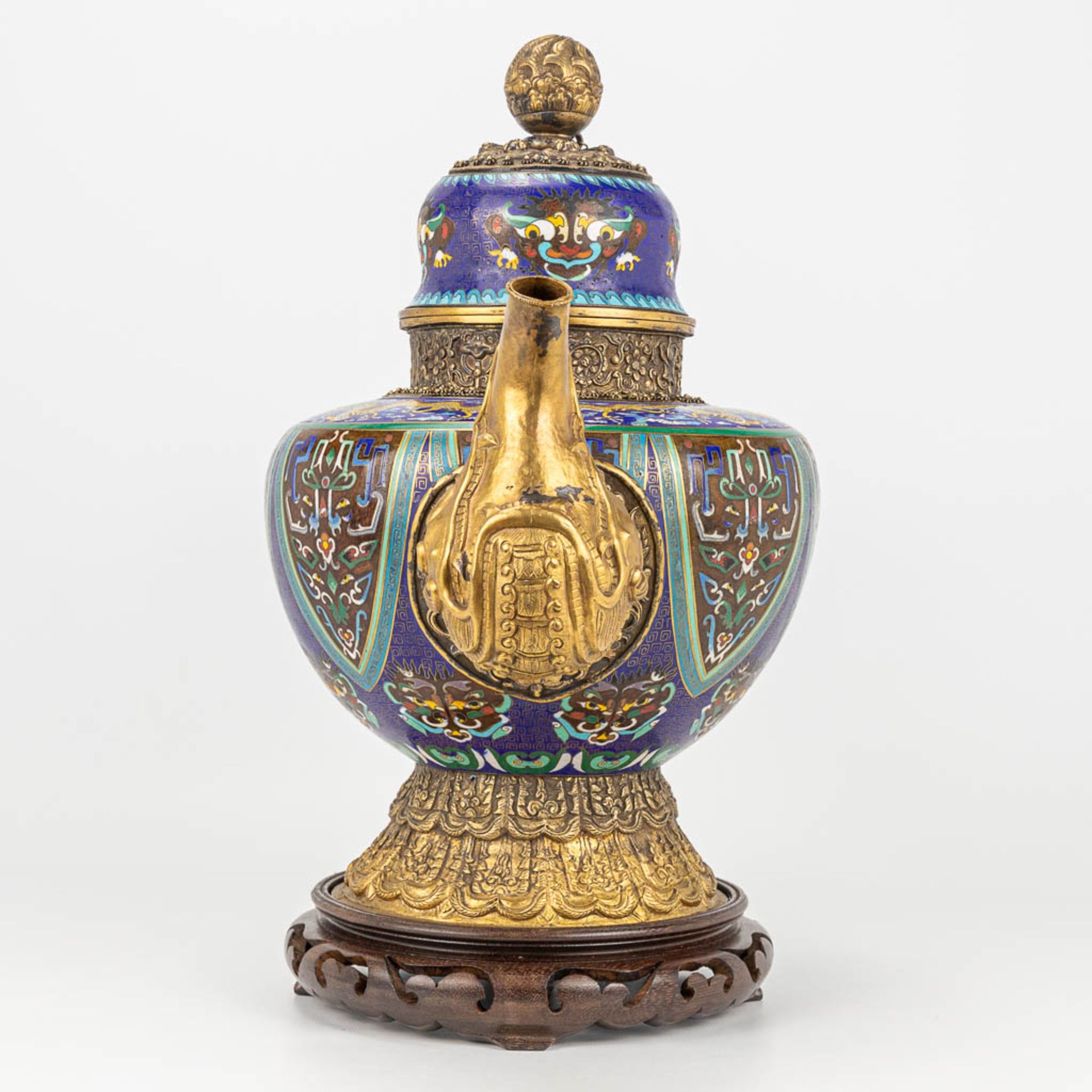 A Tibetan ceremonial ewer made of gilt bronze and finished with cloisonnŽ bronze. - Image 3 of 18