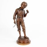 Charles ANFRIE (1833-1905) A young figurine of a boy with a top, made of bronze.