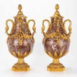A pair of cassolettes made of marble and mounted with gilt bronze.