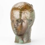 A figurative image of a young lady, made of polished bronze. Marked 'Irene' Brula
