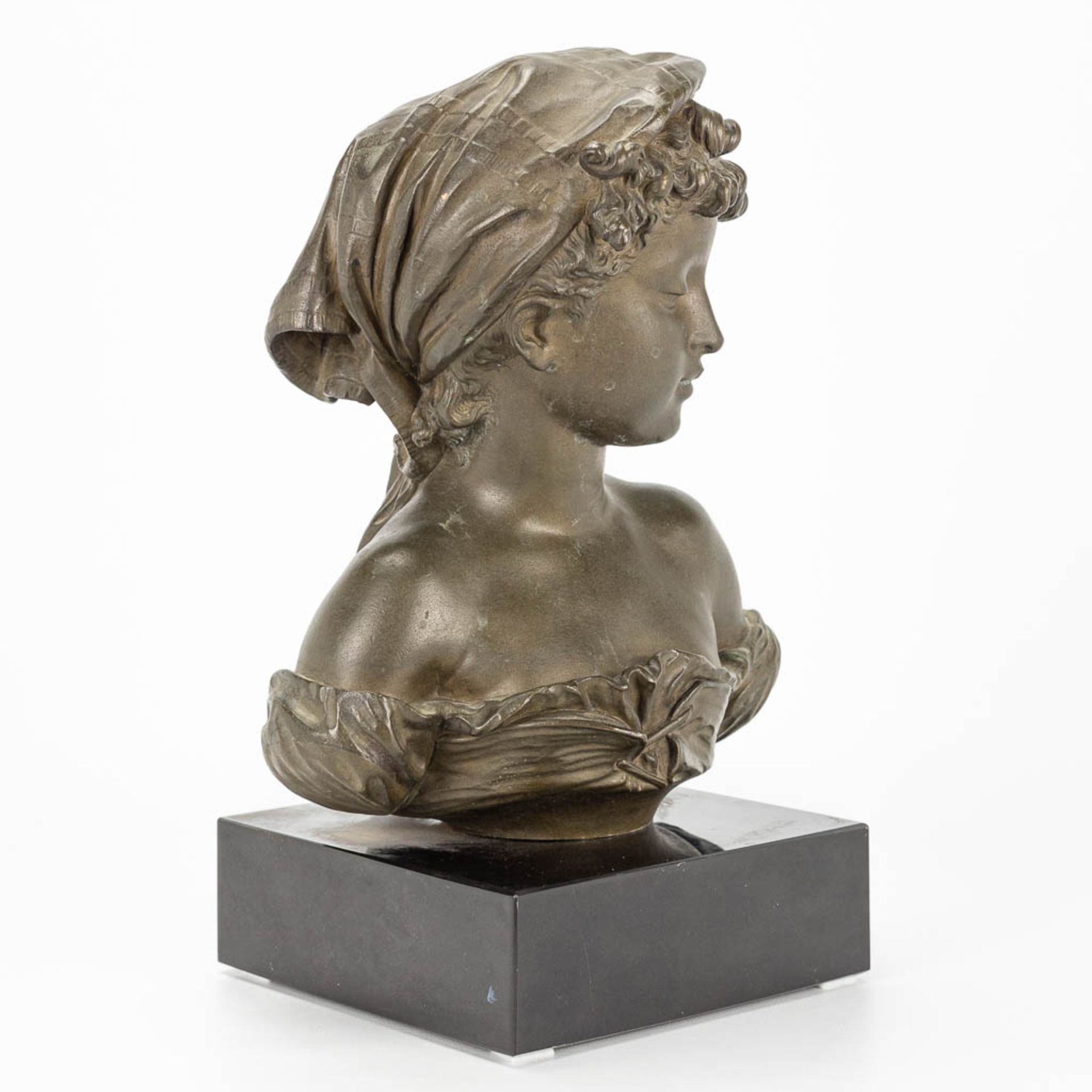 A bust of a young lady, made of bronze and marked Compagnie des bronzes, Bruxelles. - Image 6 of 11