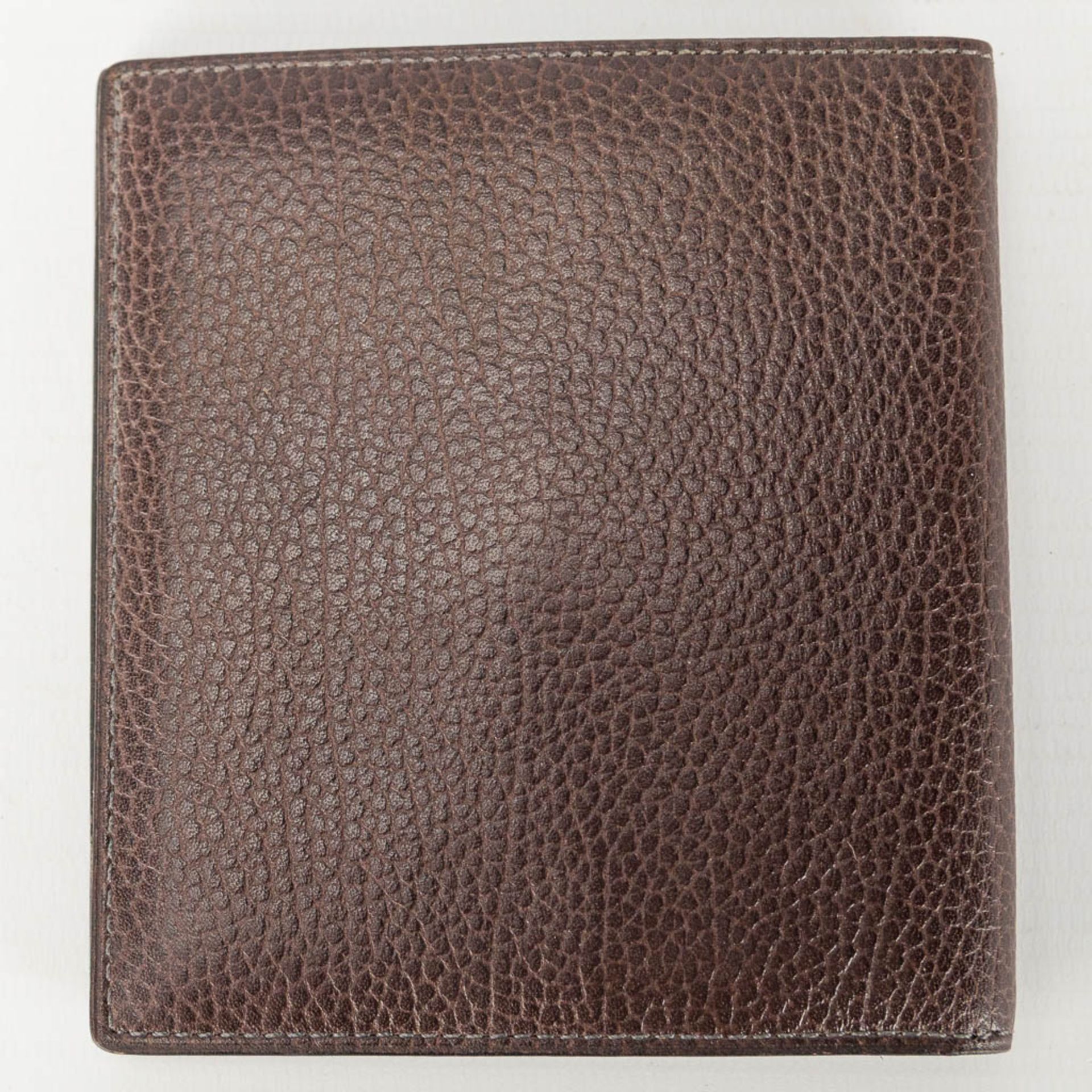 A collection of 2 wallets and a bifold made of leather and marked Delvaux. - Image 9 of 16