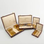A collection of 4 boxes with gold-plated silver cutlery, marked A835 and made by Wolfers.