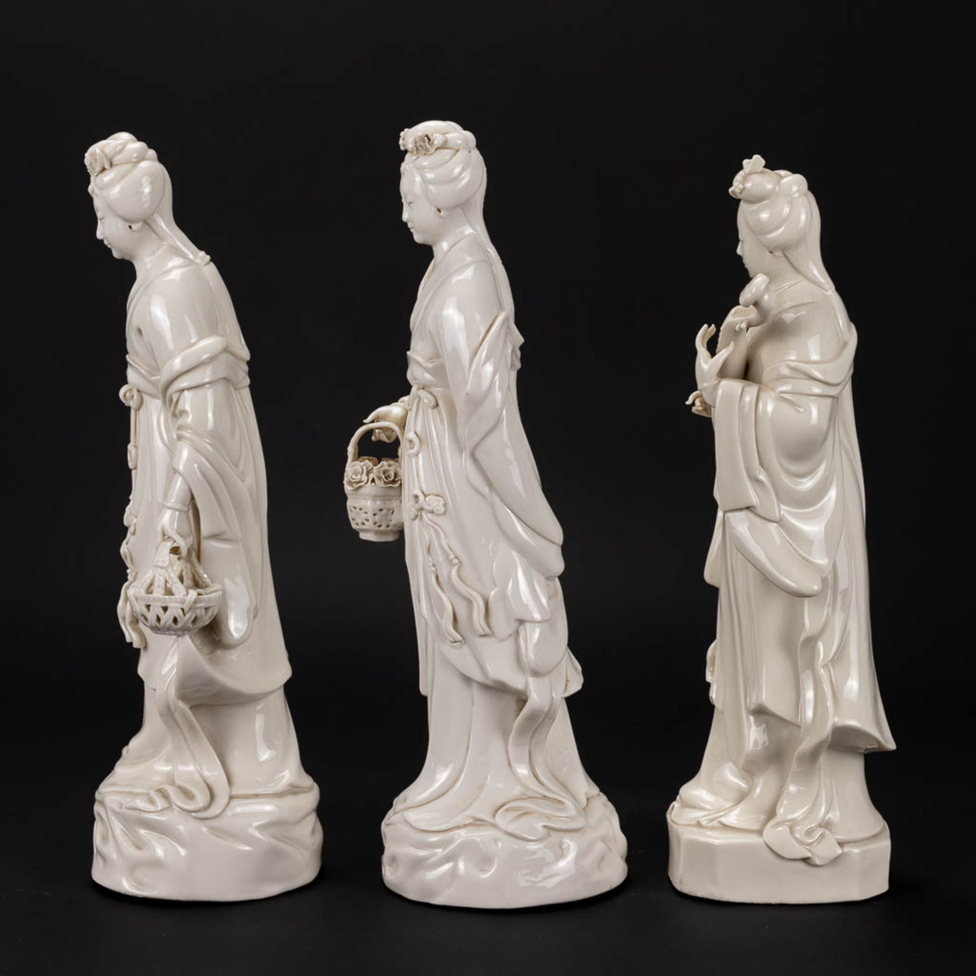 A collection of 3 female figurative statues 'Blanc De Chine' made of Chinese porcelain. - Image 6 of 16