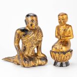 A pair of Buddha's made of gilt sculptured wood.