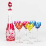 A collection of glasses with a carafe made of colored cut crystal and made by Val Saint-Lambert.
