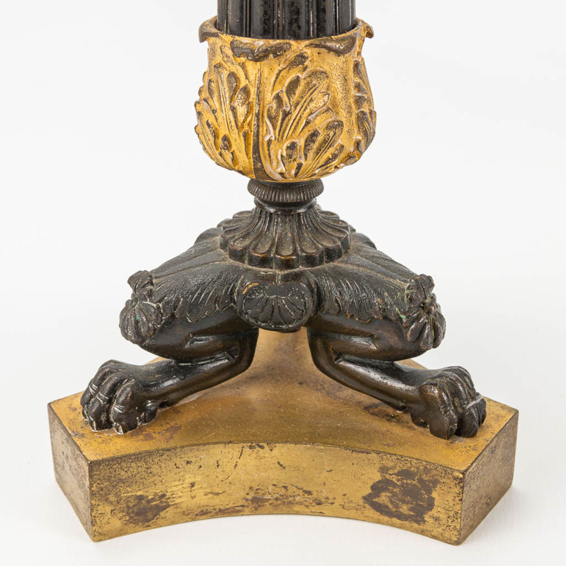 A pair of candlesticks made of gilt and patinated bronze in empire style. - Image 5 of 7