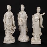 A collection of 3 female figurative statues 'Blanc De Chine' made of Chinese porcelain.