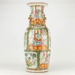A large vase made of Chinese porcelain and finished with Kanton decor.