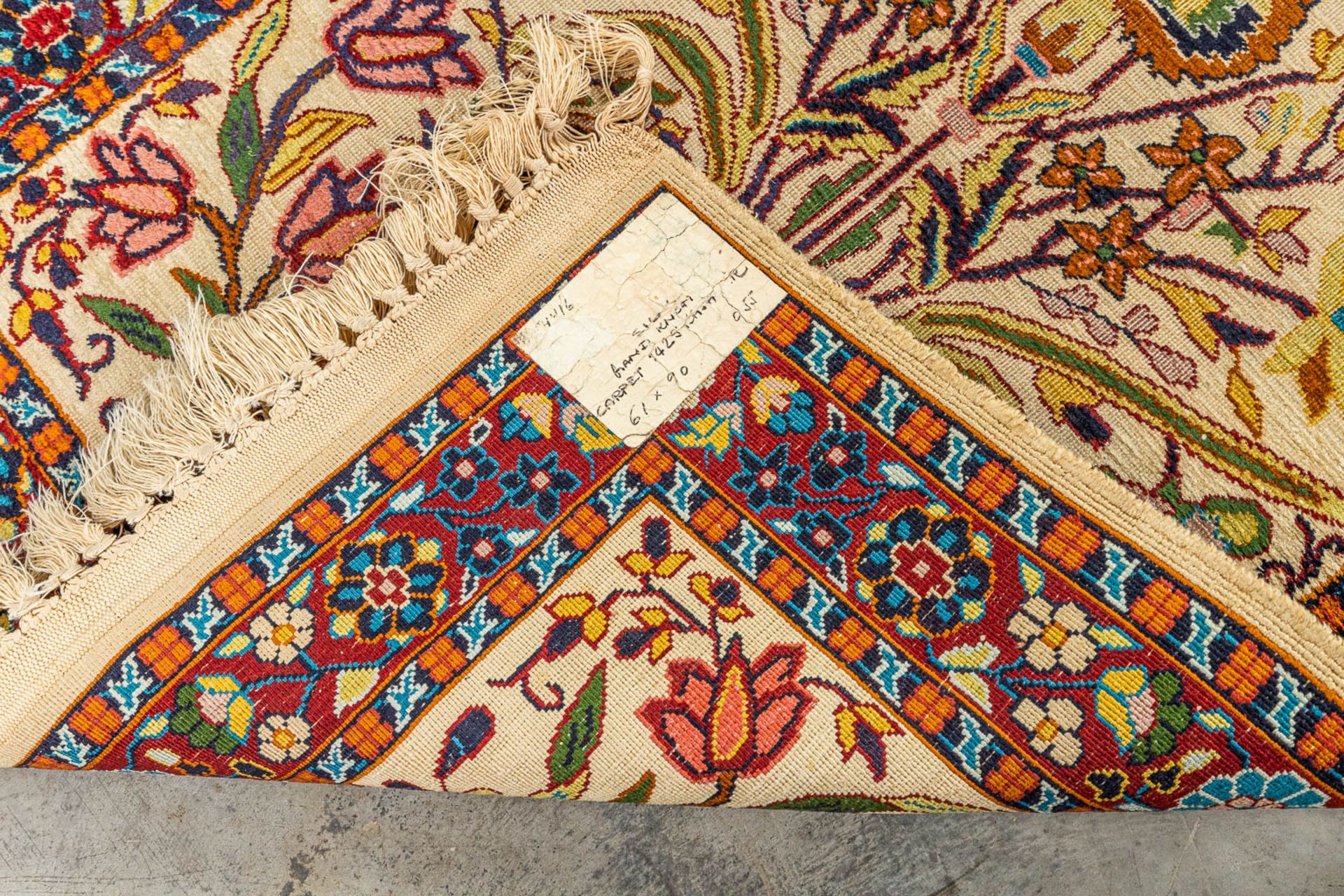 An oriental hand-made carpet made of Kashmir and wool. (90 x 61 cm) - Image 3 of 6