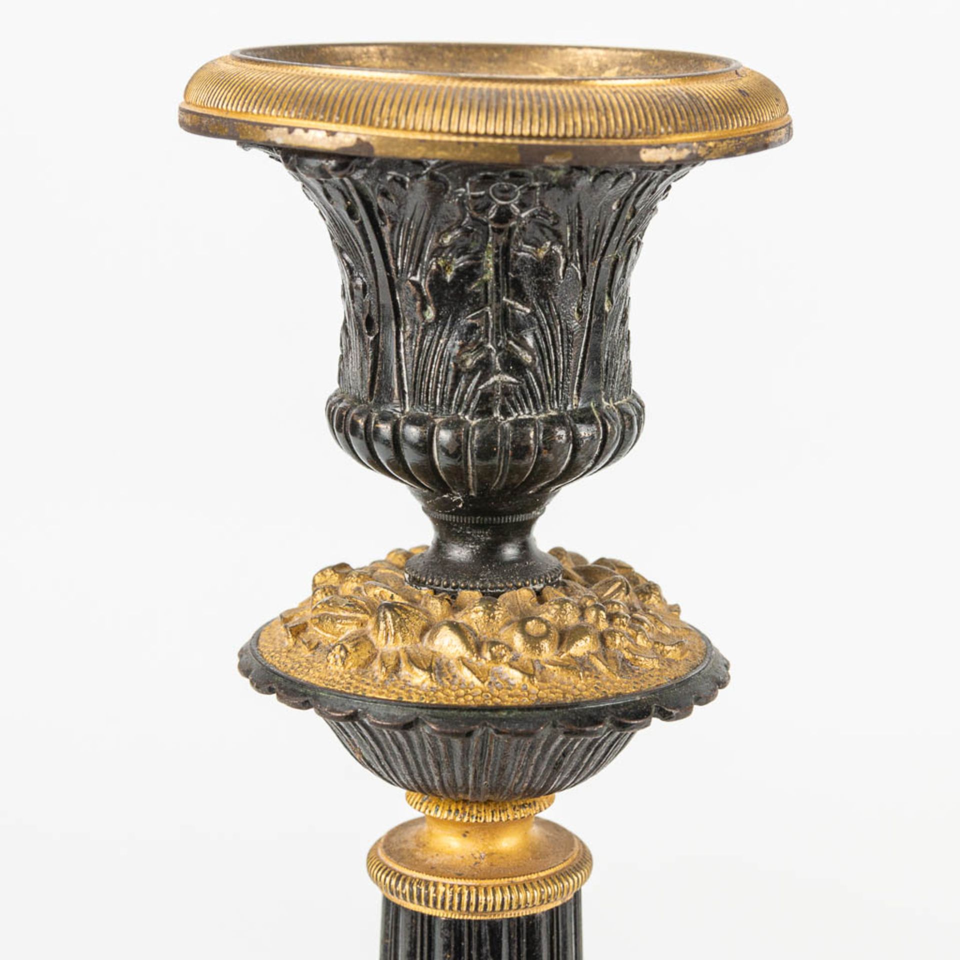 A pair of candlesticks made of gilt and patinated bronze in empire style. - Image 7 of 7