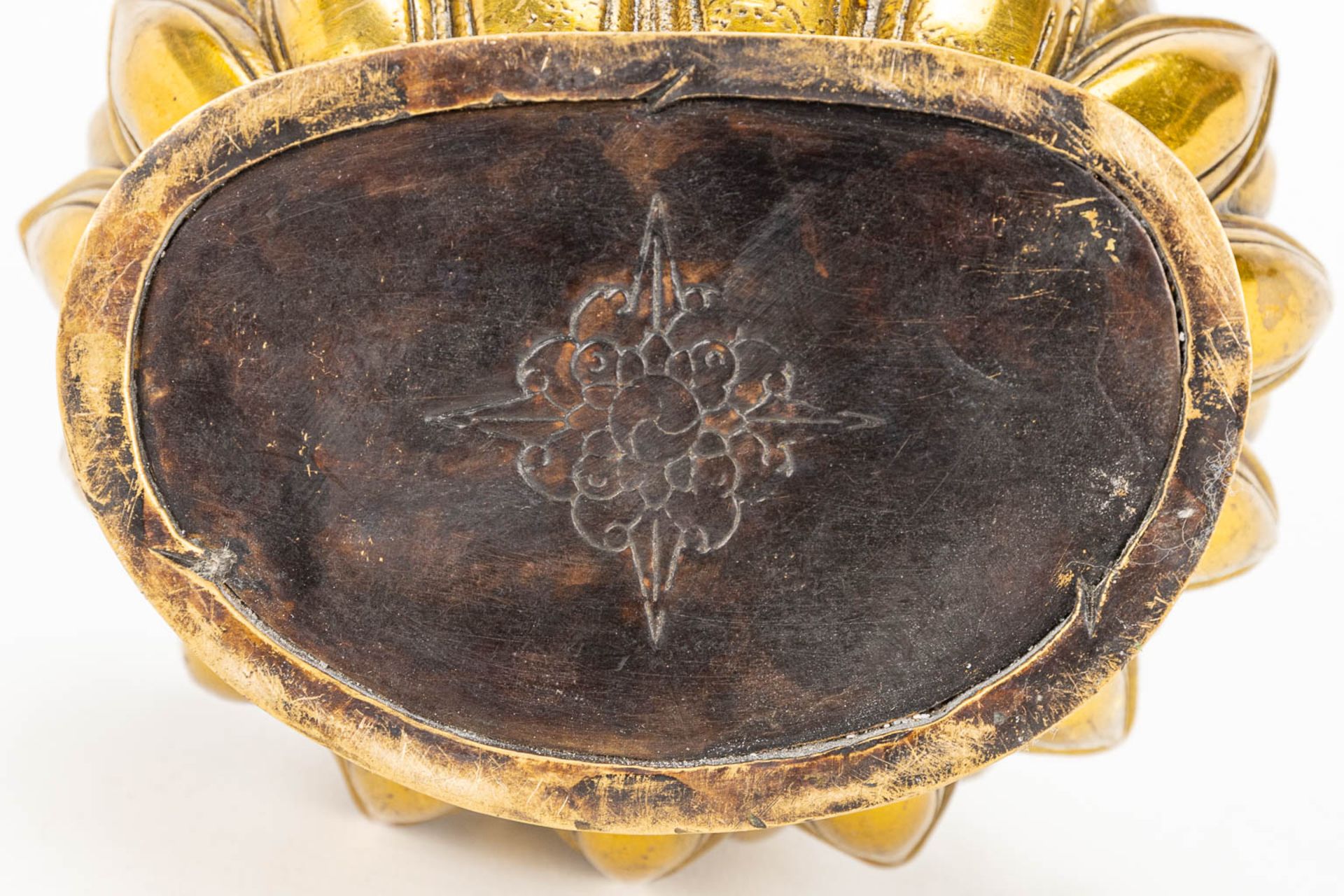 A Buddha on a lotus flower made of bronze. - Image 11 of 11