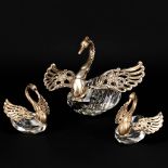 A collection of 3 sugar pots in the shape of a swan, made of crystal and solid silver.