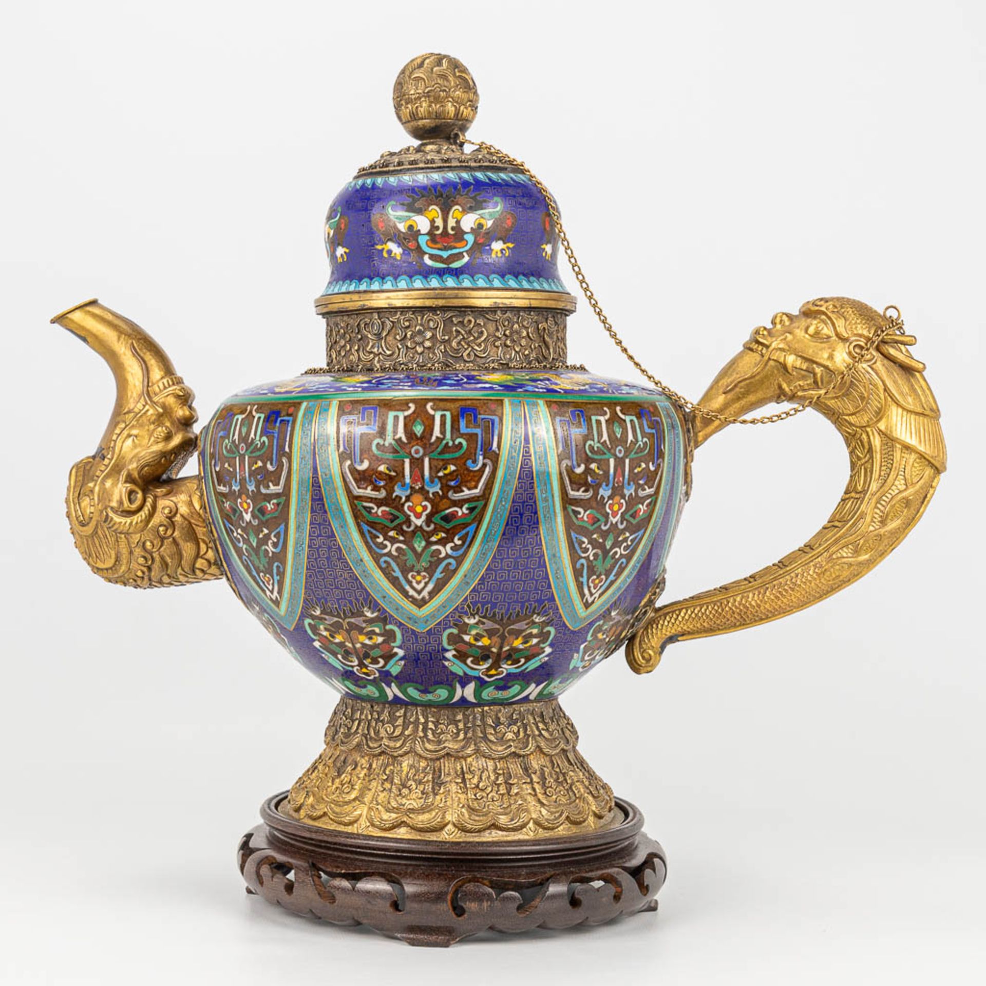 A Tibetan ceremonial ewer made of gilt bronze and finished with cloisonnŽ bronze. - Image 12 of 18