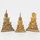 A collection of 3 seated Buddha's, made of bronze.