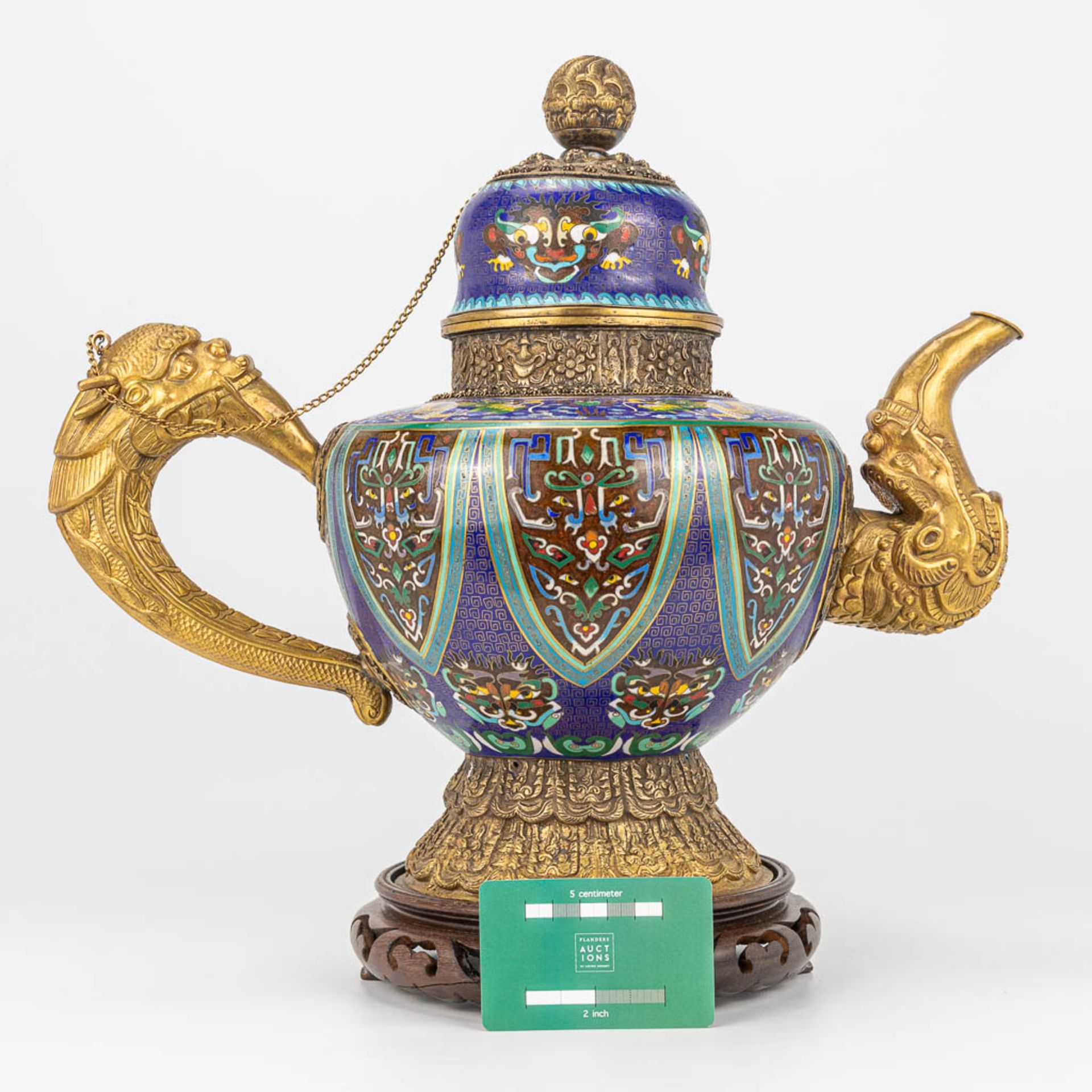 A Tibetan ceremonial ewer made of gilt bronze and finished with cloisonnŽ bronze. - Image 8 of 18