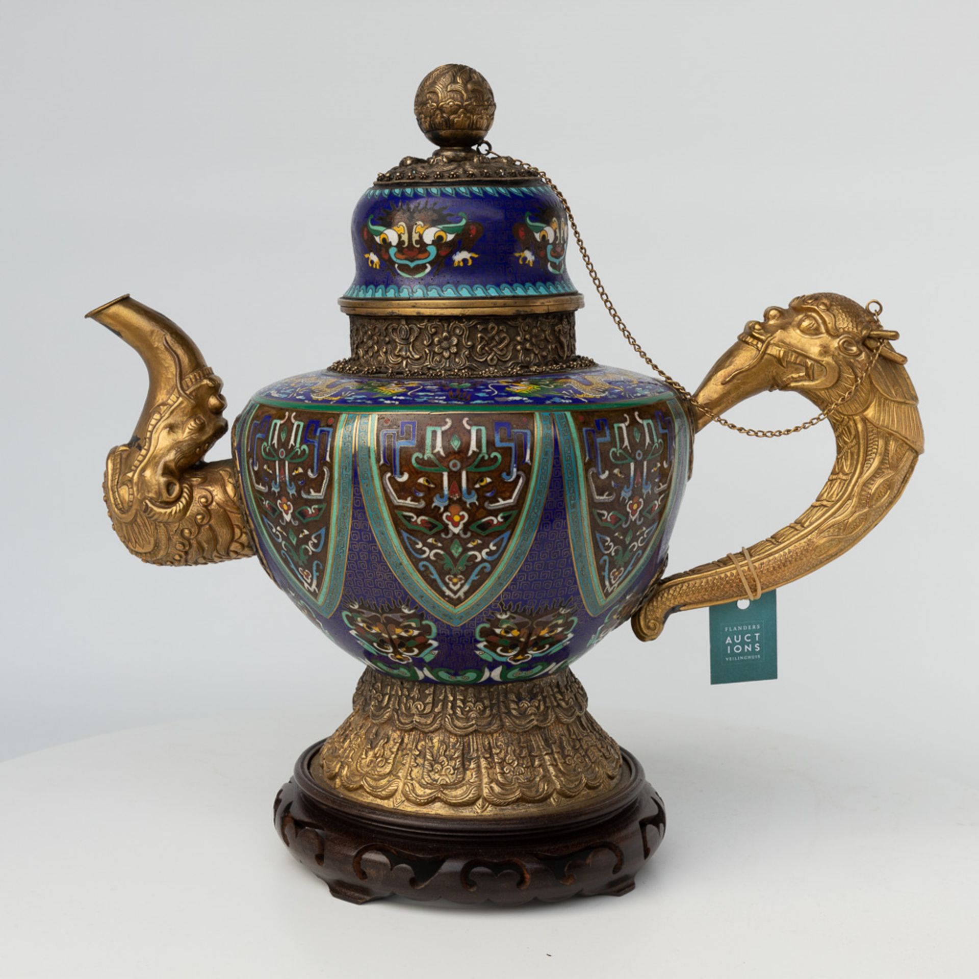A Tibetan ceremonial ewer made of gilt bronze and finished with cloisonnŽ bronze. - Image 18 of 18
