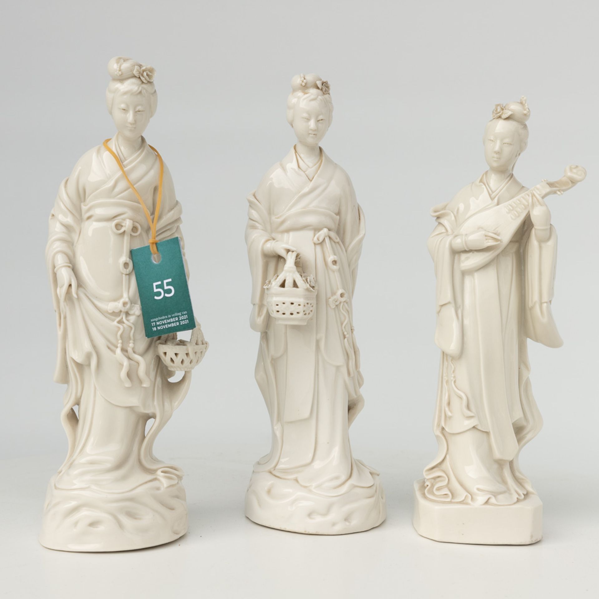 A collection of 3 female figurative statues 'Blanc De Chine' made of Chinese porcelain. - Image 15 of 16